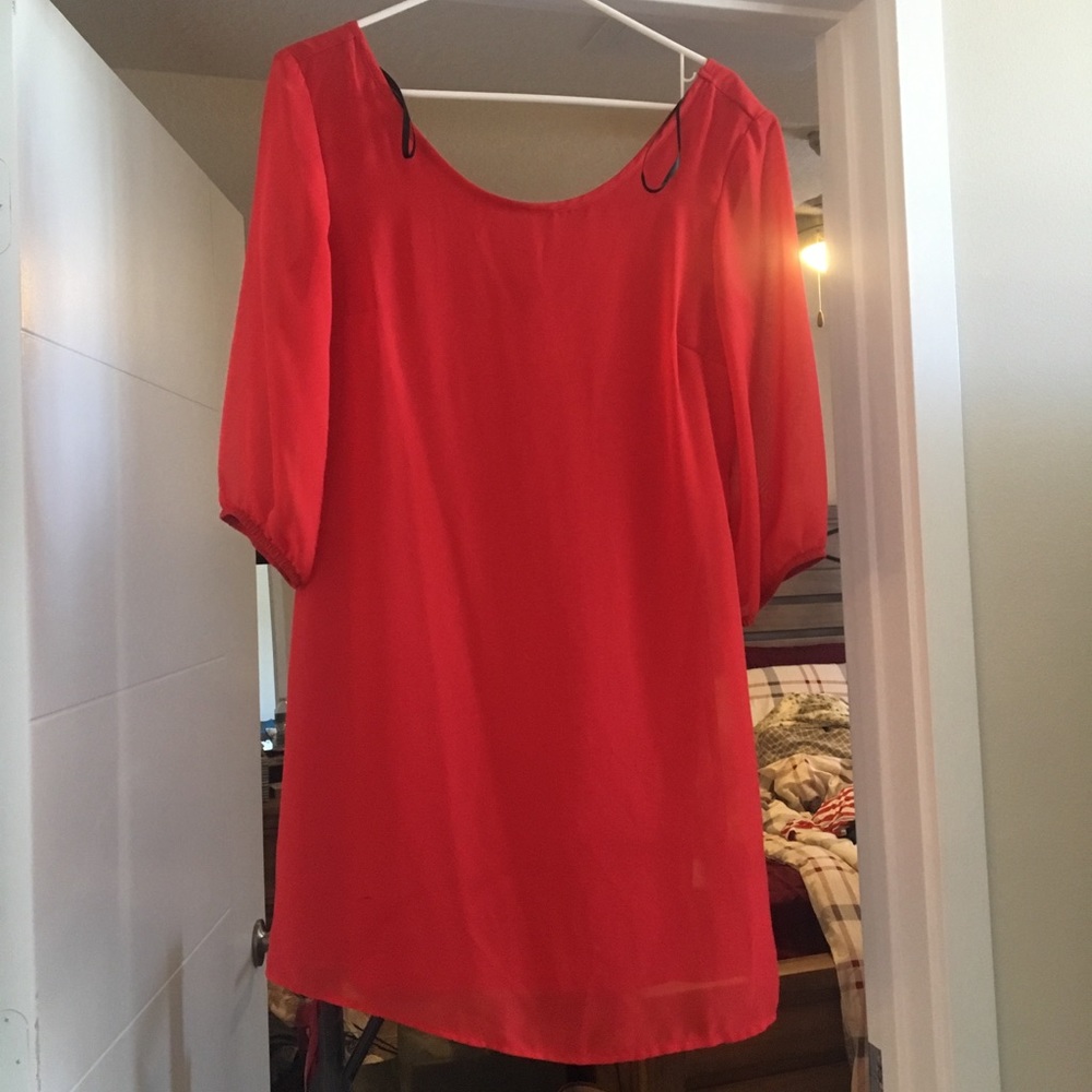 Red sleeved dress with bow on the back